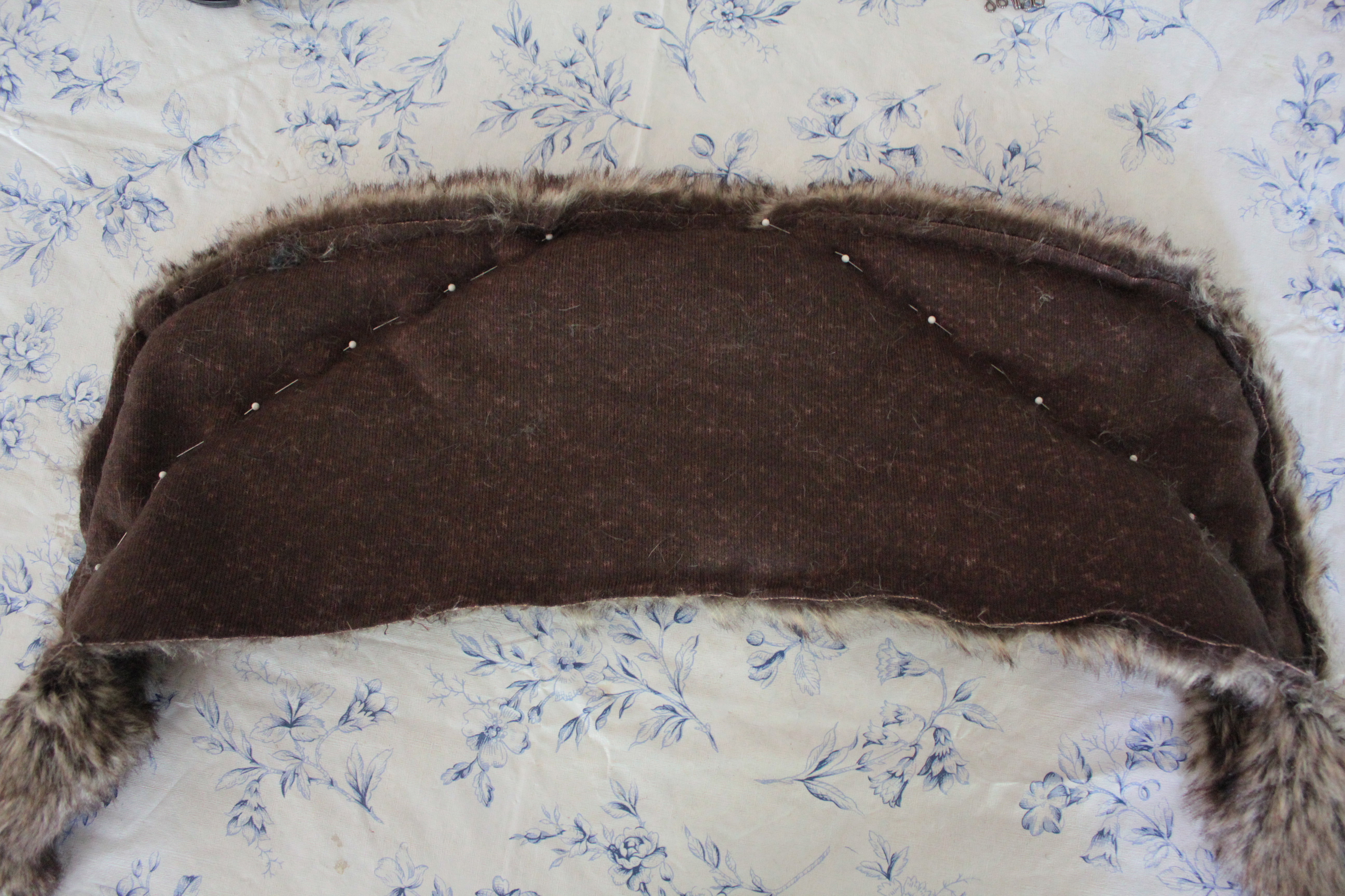 Pin two pieces of fur, right sides together: approximately 24” wide x 7” high. Mark a semi-circle on the wrong side.