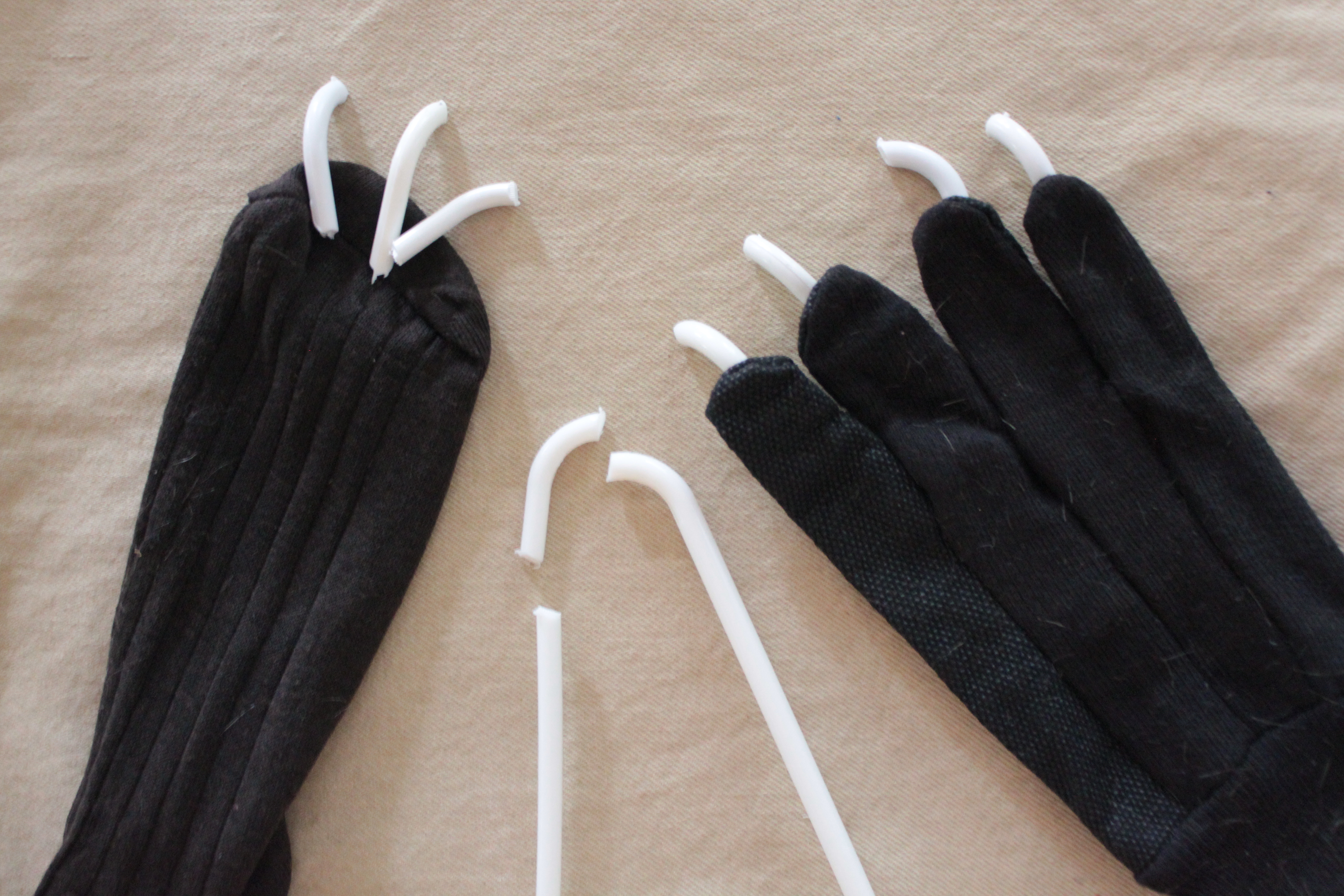 Insert plastic “claws” into the slits and hold in place with craft glue. Cut a piece of fur the size of each glove and sock; glue in place.