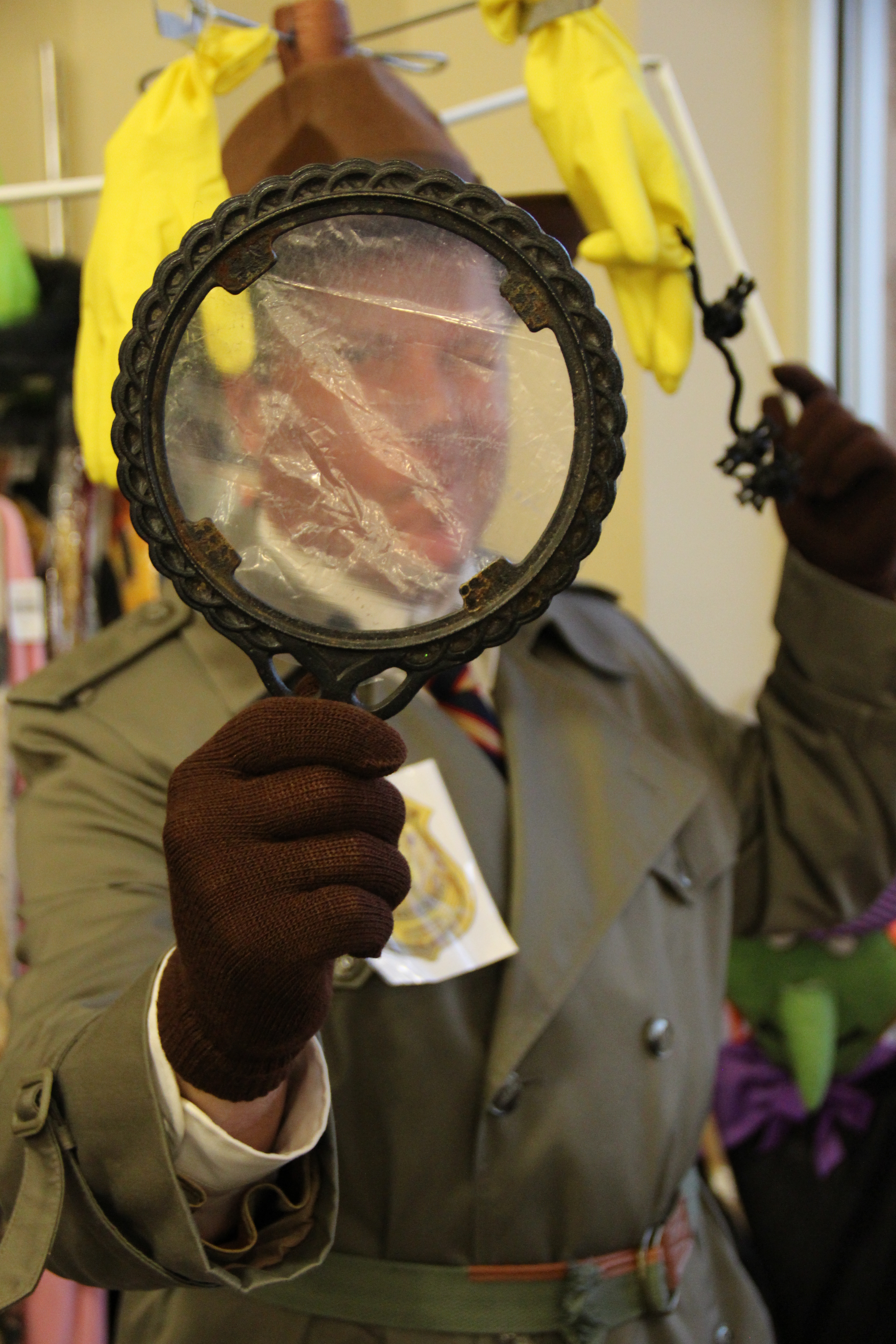 Magnifying glass: Remove the mirror from an hand-held mirror frame. Glue a plastic bag to the back of the mirror; when dry, cut off excess.
